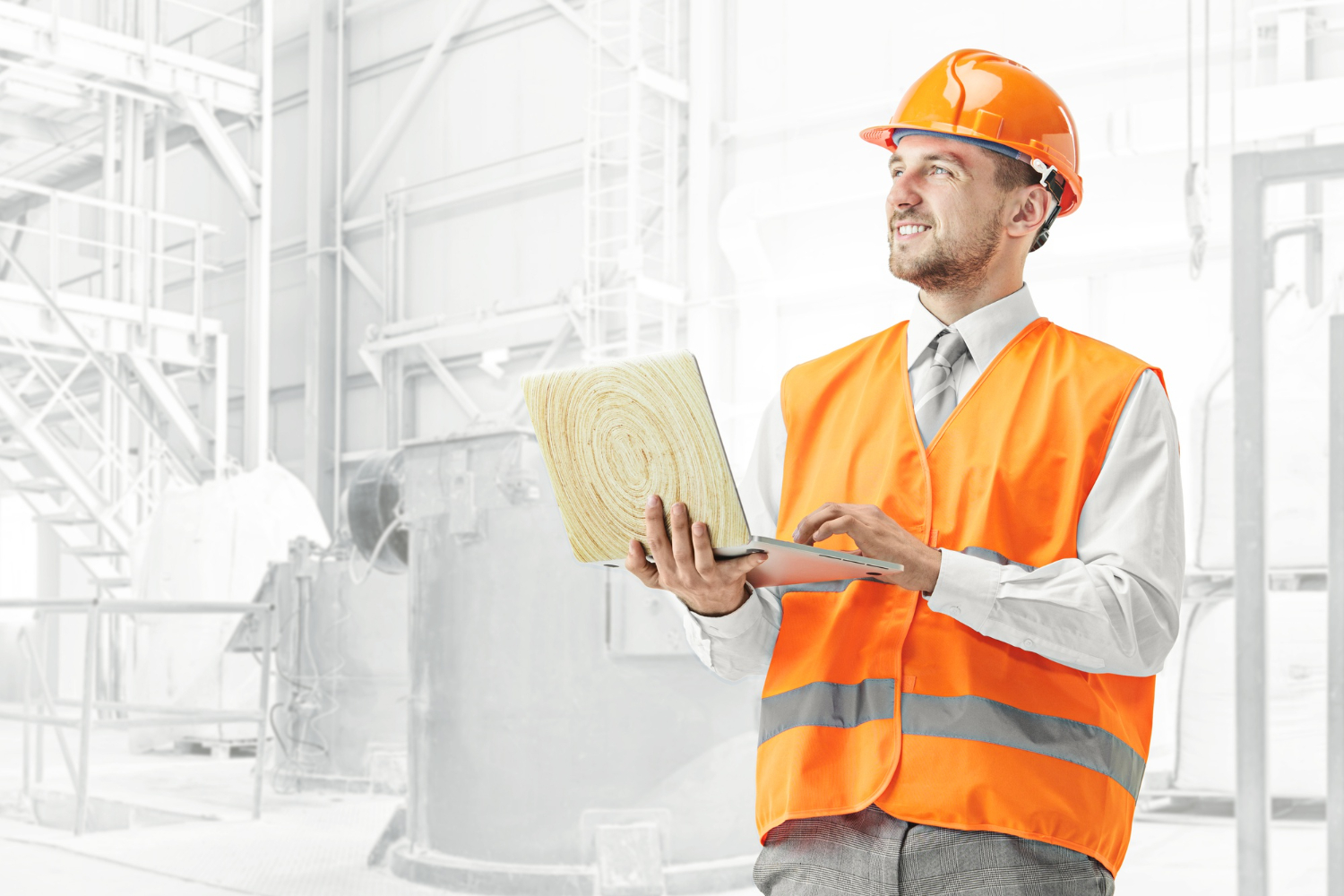 A builder in an orange helmet