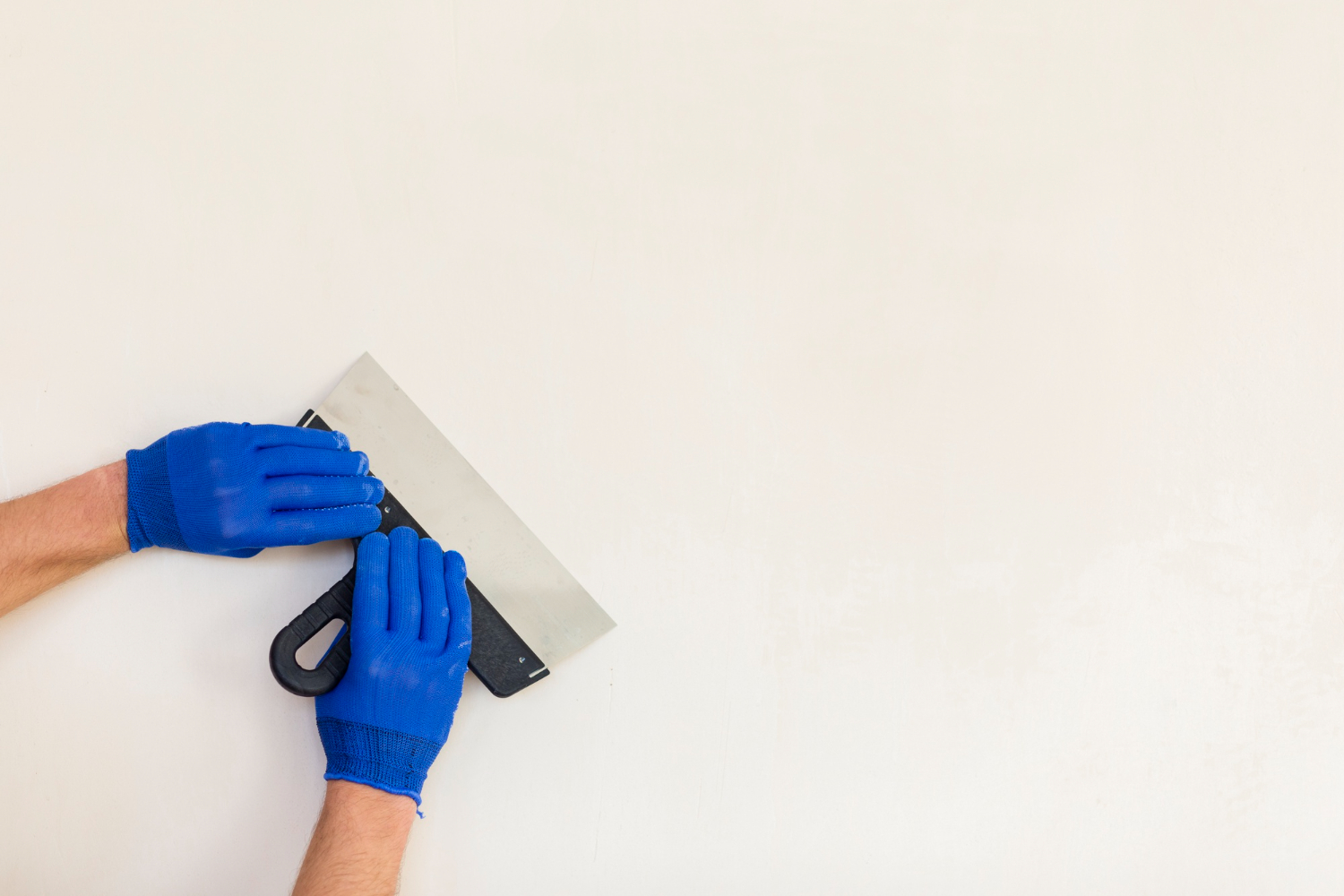 Plastering a white wall